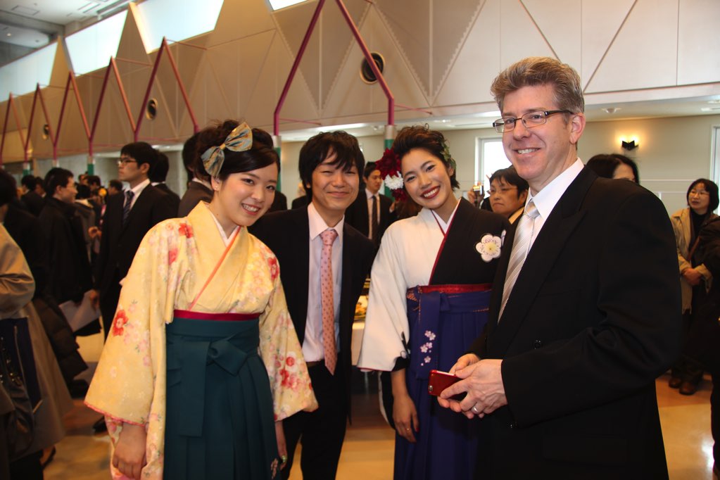 Ian Wilson with students at graduation